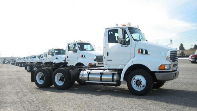 Low emission, heavy-duty trucks lined up as part of the Tetra Tech-supported Clean Truck Program